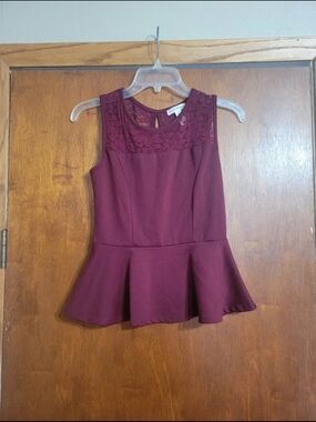 Sleeveless Lace Yoke Peplum Top in Burgundy